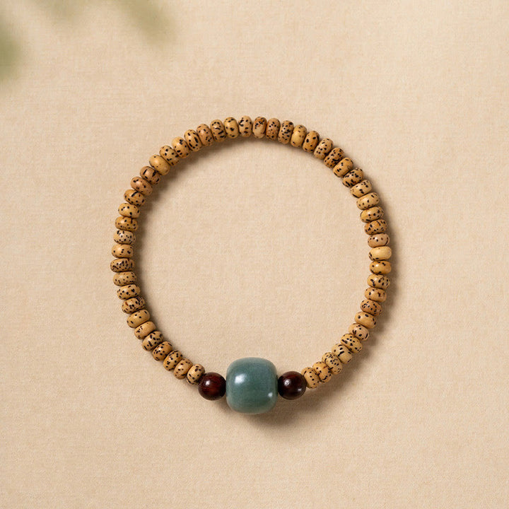 Buddha Stones Armband van Bodhizaad, kleine blaadjes en rood sandelhout. - Bodhizaad (geluk♥voorspoed) - image 0