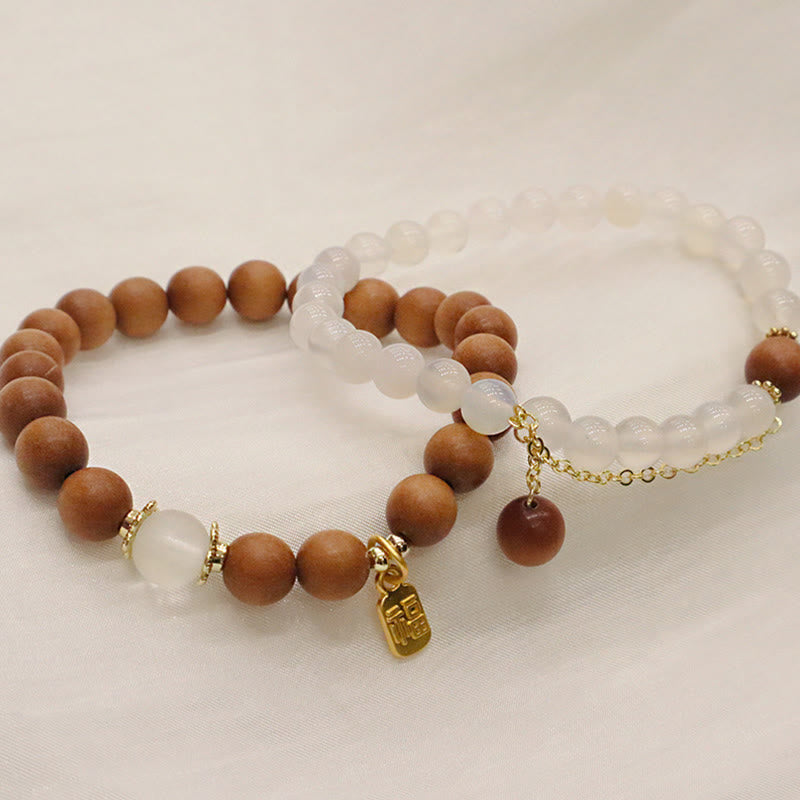 Buddha Stones Armband met bedeltje van sandelhout, kattenoog en Fu-figuur. - image 15