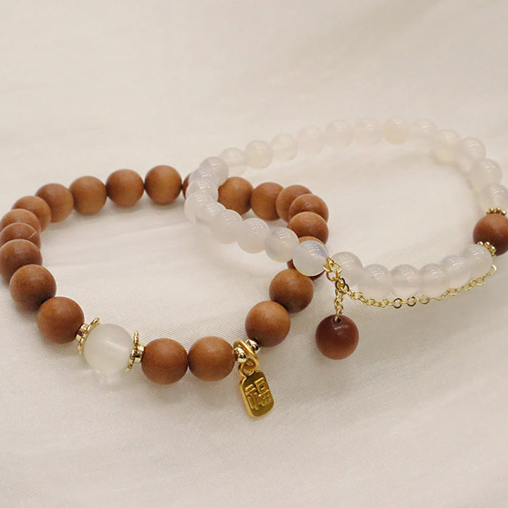 Buddha Stones Armband met bedeltje van sandelhout, kattenoog en Fu-figuur. - image 15