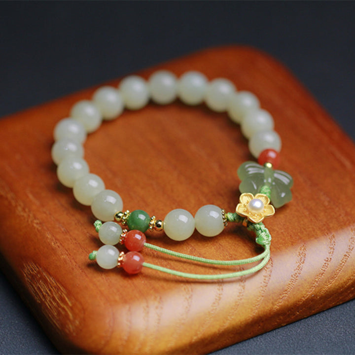 Buddha Stones Armband van 925 sterling zilver met jade, geluksbloem en vlinder. - Jade (Welvaart ♥ Overvloed) - image 0