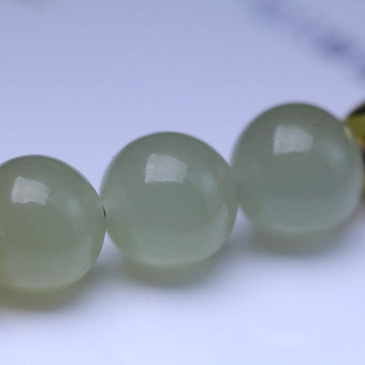 Buddha Stones Armband van natuurlijk jade, lotuszaad en rood koord. - image 9