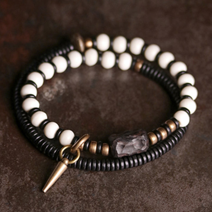 Buddha Stones Armband voor stellen, gemaakt van beenkralen, ebbenhout en koper. - image 1