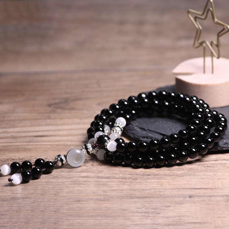 Buddha Stones Armband met kralen van zwarte onyx en witte kristallen - image 3