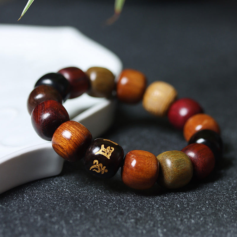 Buddha Stones Tibetaanse Armband van diverse houtsoorten met de tekst "Om Mani Padme Hum Purity". - image 1