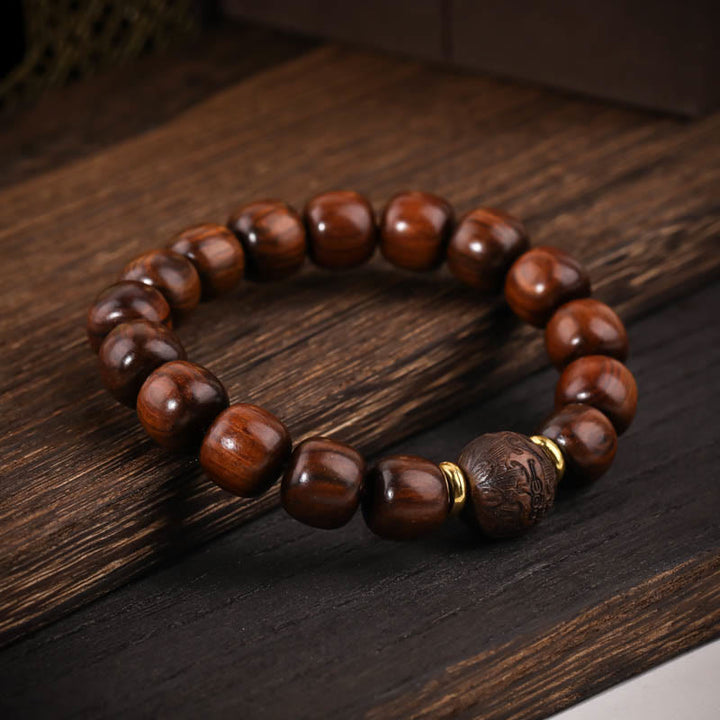 Buddha Stones Armband van natuurlijk rozenhout met symbool voor compassie. - image 1