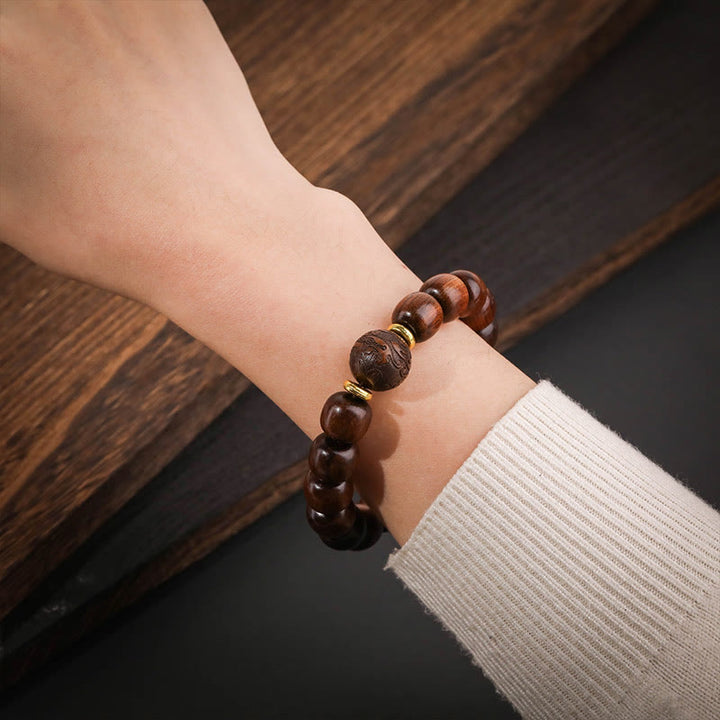 Buddha Stones Armband van natuurlijk rozenhout met symbool voor compassie. - image 3