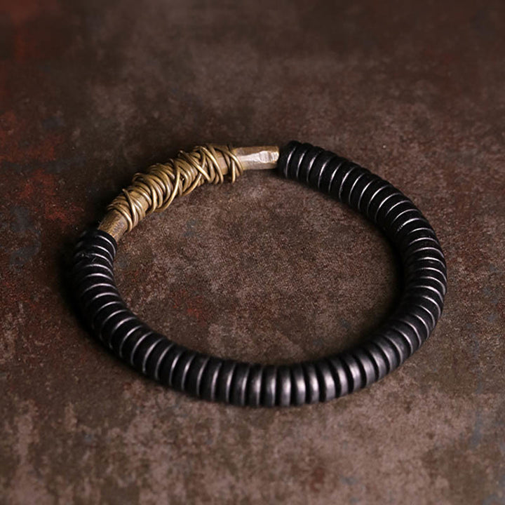 Buddha Stones Rustgevende Tibetaanse Armband van ebbenhout en koper - image 1