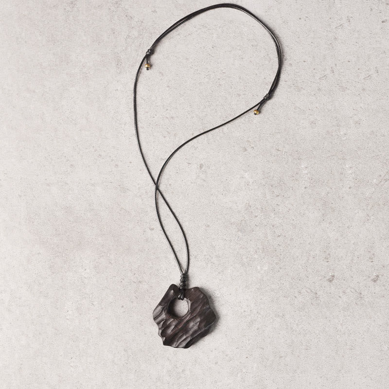Buddha Stones Ketting van ebbenhout met holle, onregelmatige vorm en vredessymbool - image 7