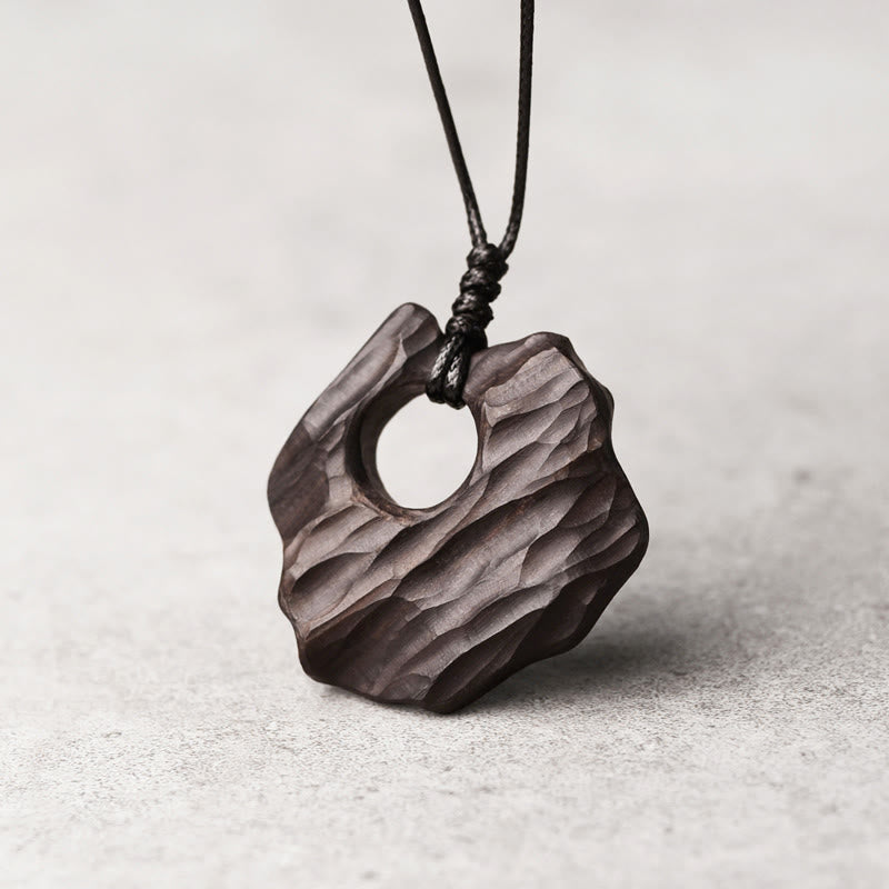 Buddha Stones Ketting van ebbenhout met holle, onregelmatige vorm en vredessymbool - image 1