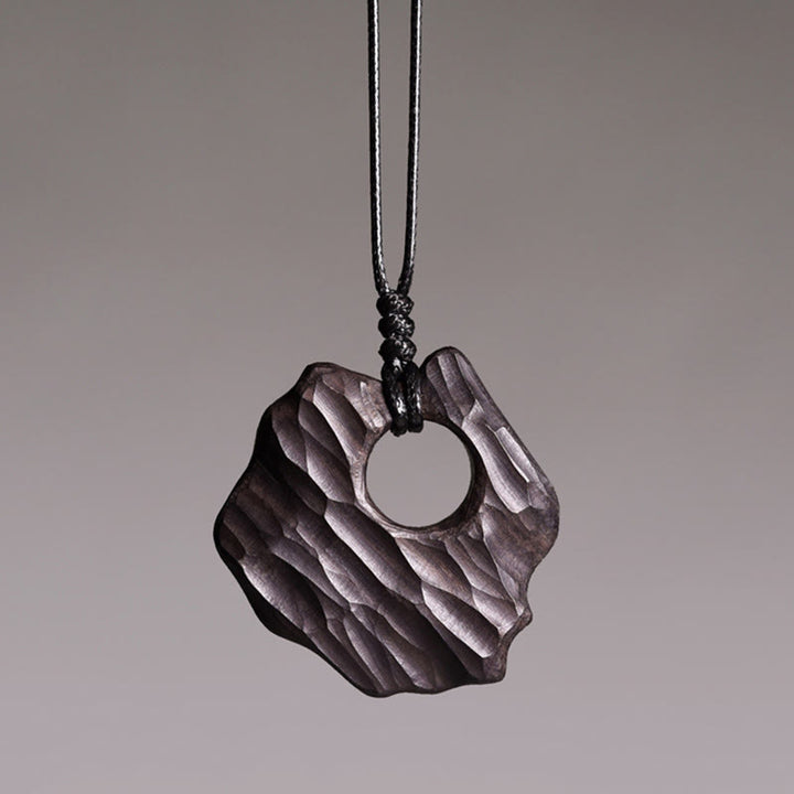 Buddha Stones Ketting van ebbenhout met holle, onregelmatige vorm en vredessymbool - Ebbenhout - image 0
