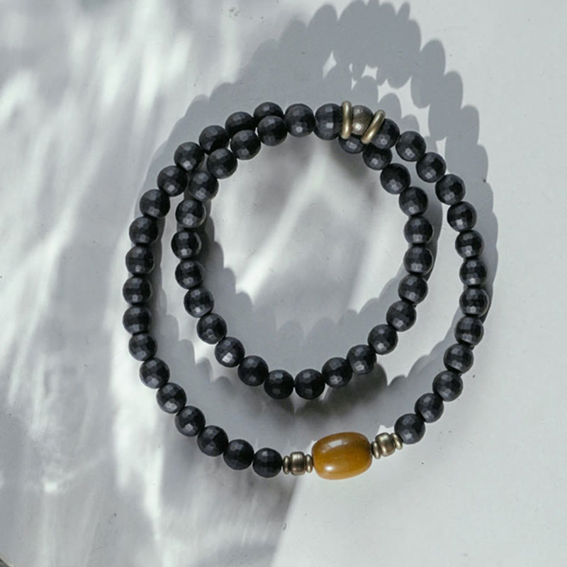 Buddha Stones Armband met dubbele bescherming en geslepen zwarte onyx-topaas kralen en een matte afwerking. - image 1