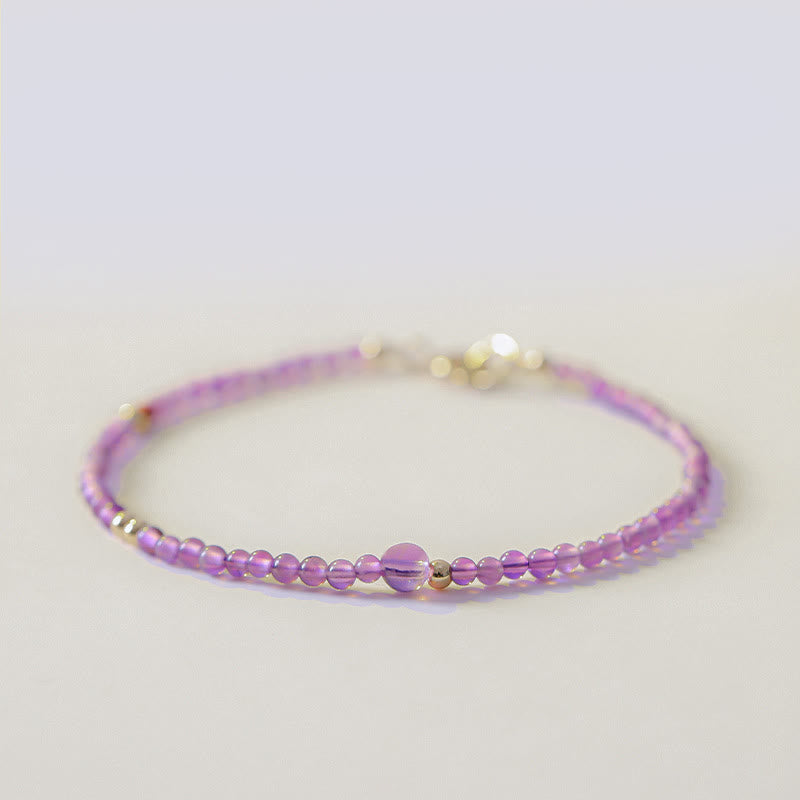 Buddha Stones Armband voor innerlijke rust, gemaakt van 2 mm ultradunne kralen van natuurlijke amethist en 14k verguld koper. - 2 mm amethist (Polsomtrek: 16 cm) - image 0