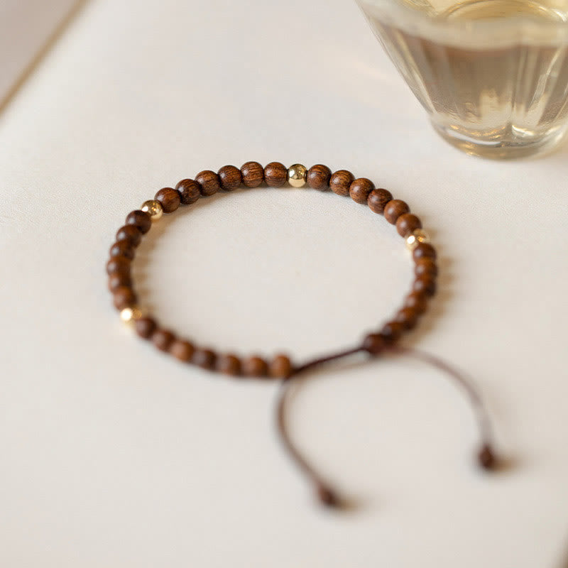Buddha Stones 4 mm ultradunne sandelhouten kralen met 14 karaats verguld koperen Armband - image 1