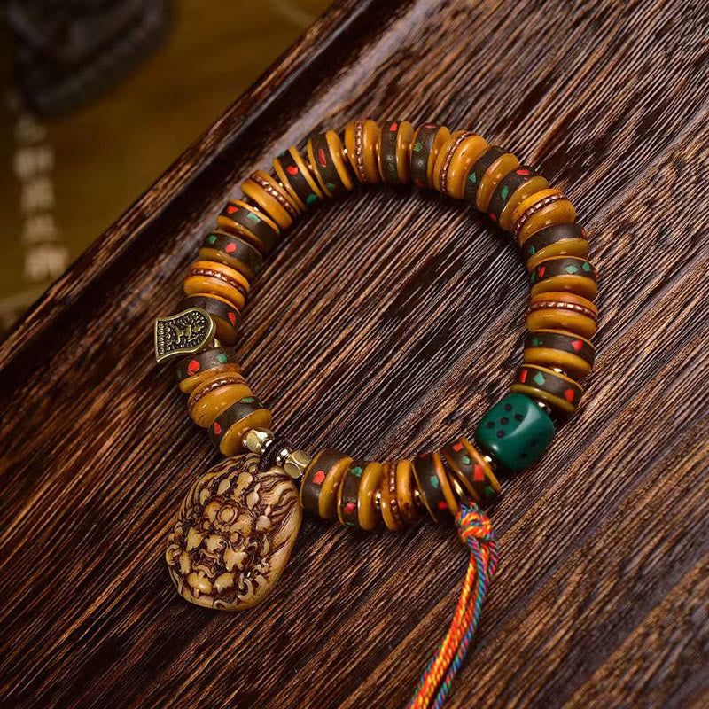 Buddha Stones Tibetaanse Armband met kwastje van kameelbot en dobbelstenen - image 1
