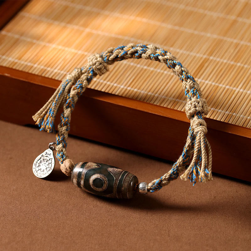 Buddha Stones Handgemaakte Tibetaanse Dzi-kralen Armband met gevlochten koord voor bescherming van rijkdom. - Dzi-kraal (Polsomtrek 14-16 cm) - image 0