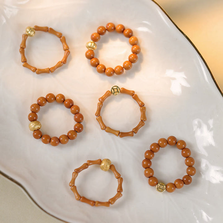 Buddha Stones Olijfpitkraal Koperen Munt Binnenste Ring - image 17