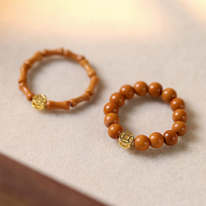 Buddha Stones Olijfpitkraal Koperen Munt Binnenste Ring - image 0