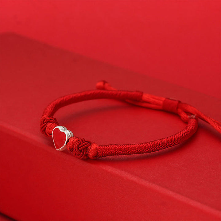 Buddha Stones Armband van 999 sterling zilver met 3D-hartontwerp en rood koordje. - image 1