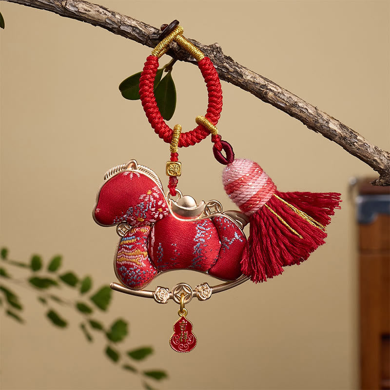 Buddha Stones Sleutelhanger met veelkleurig ontwerp van een kalebas in de vorm van een baar, symbool voor vrijheid en voorspoed. - Rood Paard 12*3mm - image 0