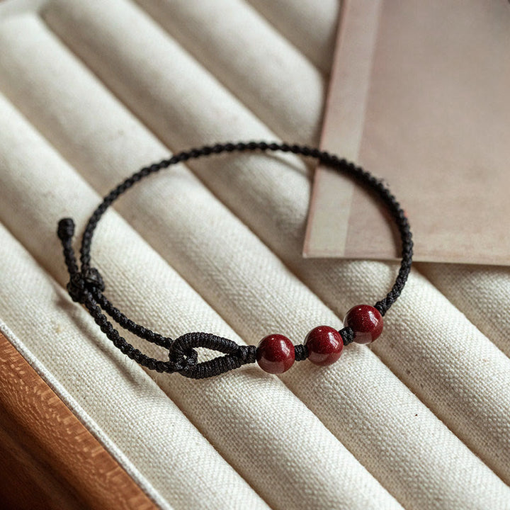 Buddha Stones Handgemaakte Armband van gevlochten touw met cinnaberkralen en een kalmerend effect. - Zwart touw (Polsomtrek 16-18 cm) - image 9