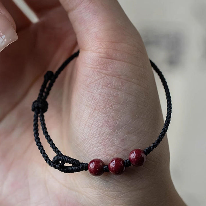 Buddha Stones Handgemaakte Armband van gevlochten touw met cinnaberkralen en een kalmerend effect. - image 10