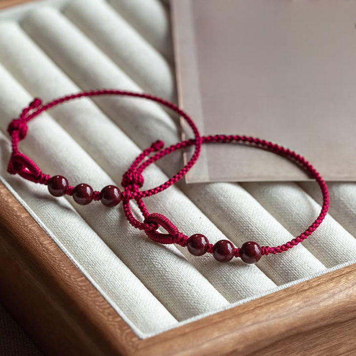 Buddha Stones Handgemaakte Armband van gevlochten touw met cinnaberkralen en een kalmerend effect. - image 4