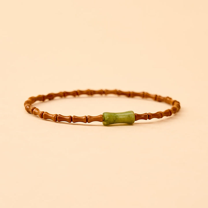Buddha Stones Armband met natuurlijke olijfpit, peridot en bamboe design - image 4