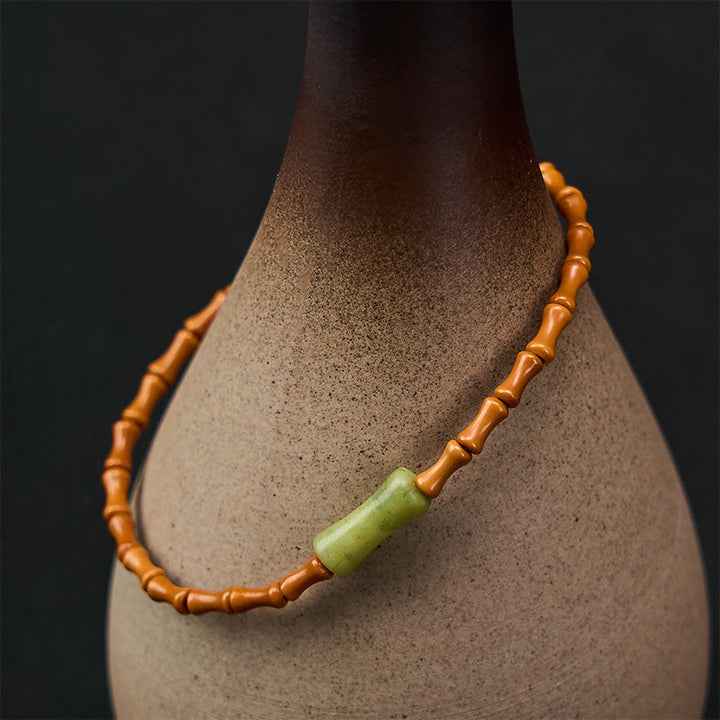 Buddha Stones Armband met natuurlijke olijfpit, peridot en bamboe design - image 1