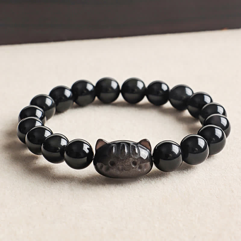 Buddha Stones Handgesneden kattenhanger van obsidiaan met zilverkleurige glans, symbool voor rust en sereniteit, handgemaakte Armband . - Zilverglanzende obsidiaan (Aarding ♥ Intuïtie) - image 0