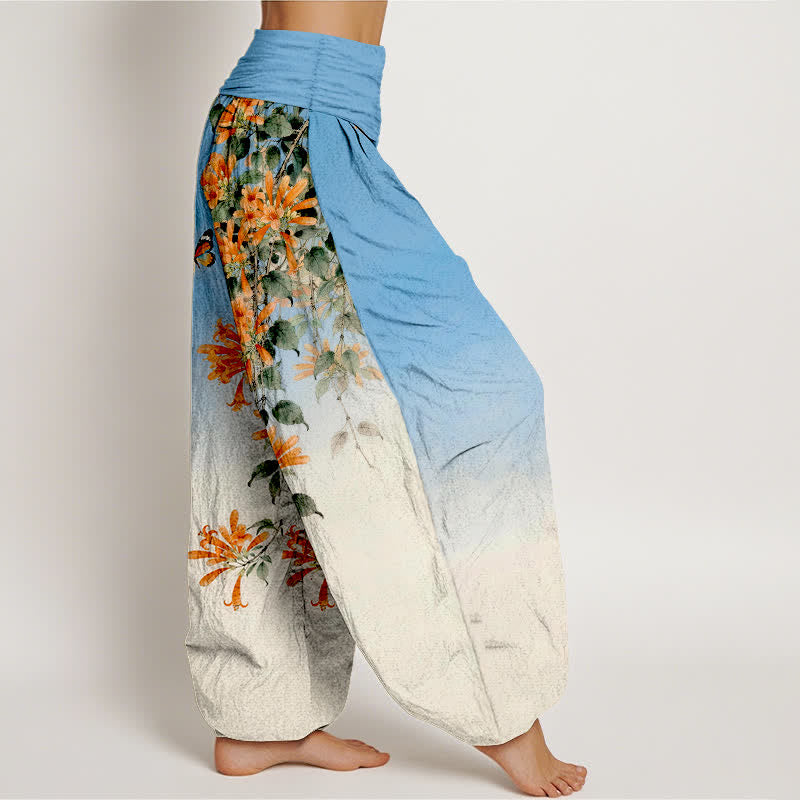 Buddha Stones Dames harembroek met elastische Taille , gemaakt van katoen in oranje met bloemen- en vlinderpatroon. - image 1