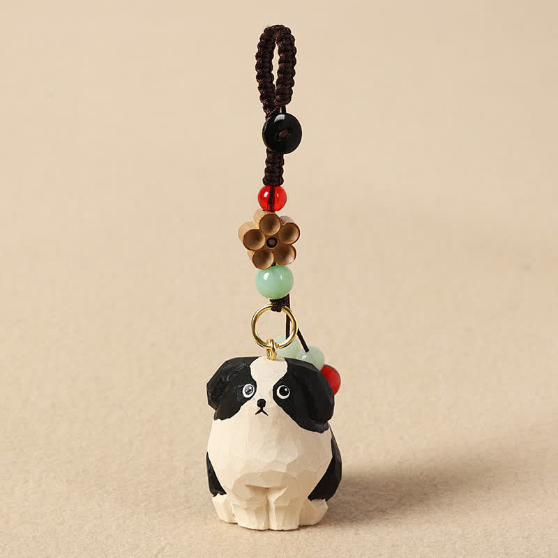 Buddha Stones Sleutelhangers van gesneden houten hondje Om Mani Padme Hum Wijsheid - Zwart-witte hond - image 0