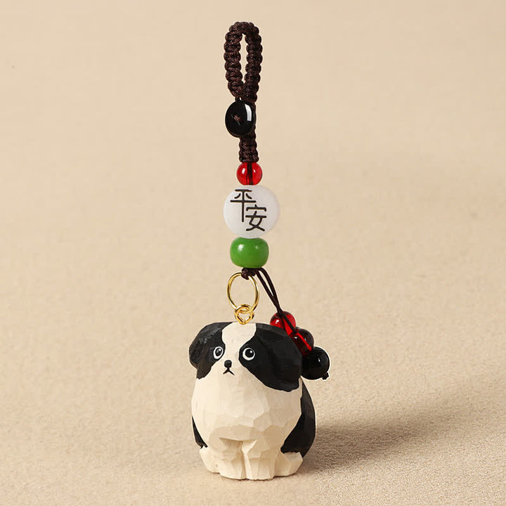 Buddha Stones Sleutelhangers van gesneden houten hondje Om Mani Padme Hum Wijsheid - Veilige zwart-witte hond - image 1