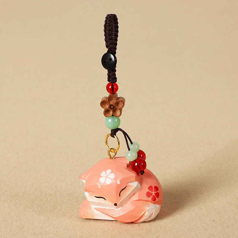 Buddha Stones Sleutelhangers met een uitgesneden houten vos, de symbolen Om Mani Padme Hum en de wijsheidssymbolen. - image 1