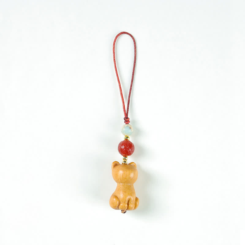 Buddha Stones Handgesneden sandelhouten Sleutelhangers met meervalmotief voor zuivering. - Kat - image 1