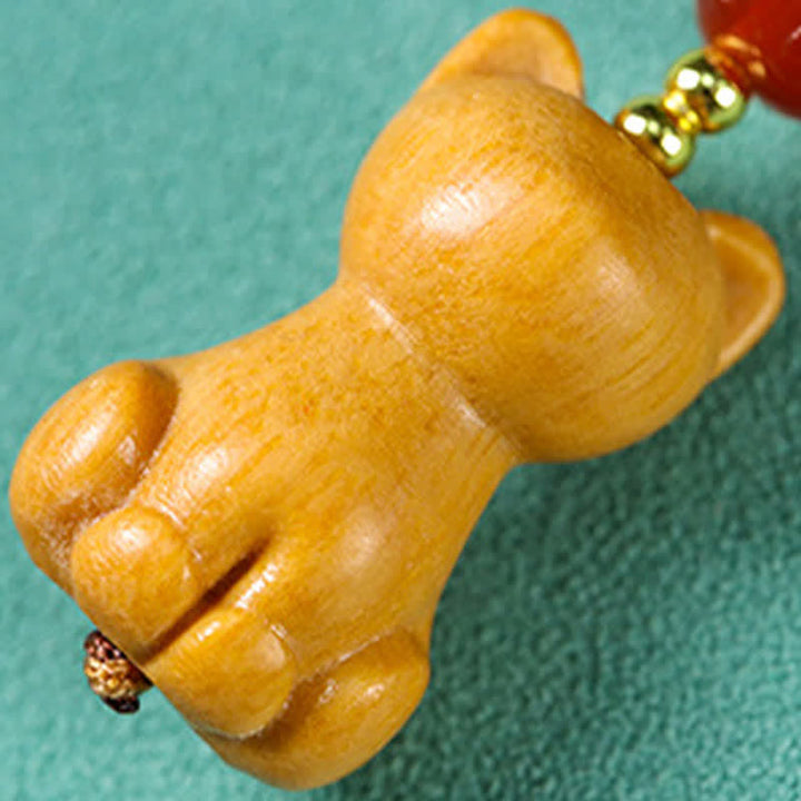 Buddha Stones Handgesneden sandelhouten Sleutelhangers met meervalmotief voor zuivering. - image 3