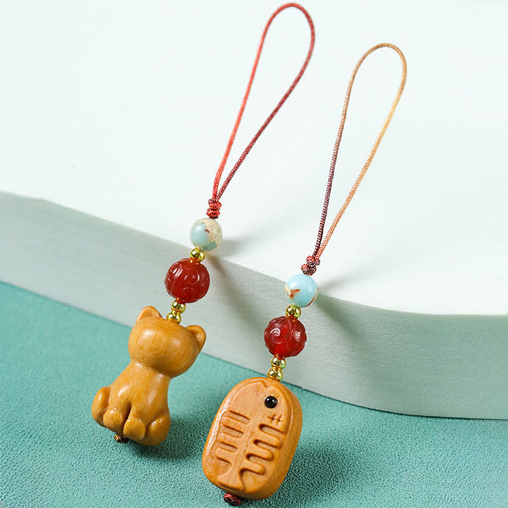 Buddha Stones Handgesneden sandelhouten Sleutelhangers met meervalmotief voor zuivering. - image 9