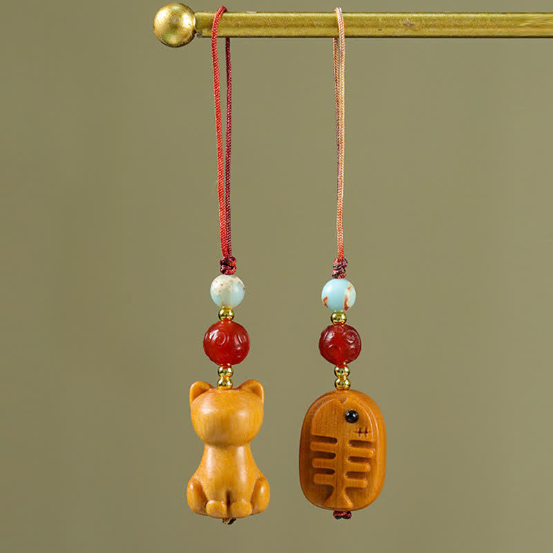Buddha Stones Handgesneden sandelhouten Sleutelhangers met meervalmotief voor zuivering. - image 0