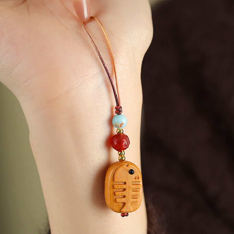 Buddha Stones Handgesneden sandelhouten Sleutelhangers met meervalmotief voor zuivering. - image 8