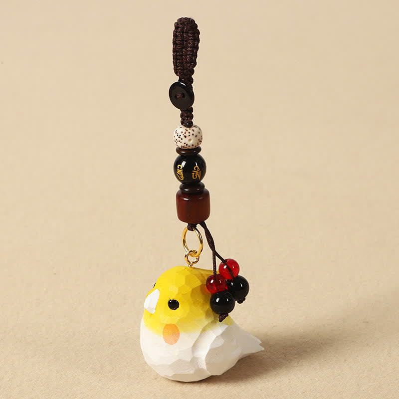 Buddha Stones Handgesneden Sleutelhangers van natuurlijk hout met de afbeelding van een valkparkiet (Om Mani Padme Hum Focus). - Valkparkiet Om Mani Padme Hum - image 0