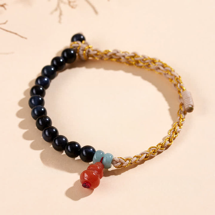 Buddha Stones Handgeweven Armband van blauwe tijgeroog en kalebas ter bevordering van kracht. - image 1