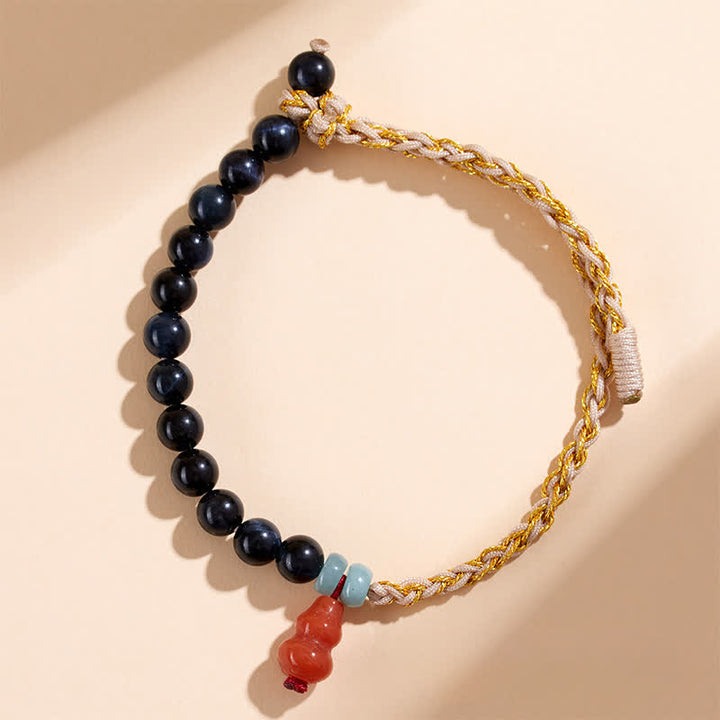 Buddha Stones Handgeweven Armband van blauwe tijgeroog en kalebas ter bevordering van kracht. - Tijgeroog (Bescherming ♥ Balans) - image 0