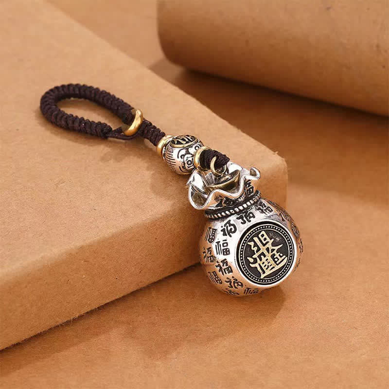 Buddha Stones Sleutelhangers met het symbool van de koperen Fu geldzak en zegen. - image 1