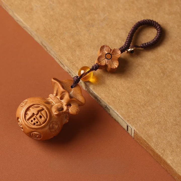 Buddha Stones Sleutelhangers met lotusbloemmotief en afbeelding van perzikhout. - Pruimenbloesem Bruin Touw - image 0