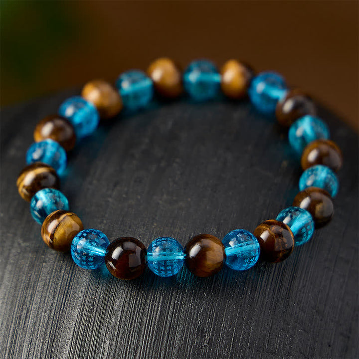 Buddha Stones Ronde Armband met tijgeroogblauwe Liuli-glaskralen en de tekst &
