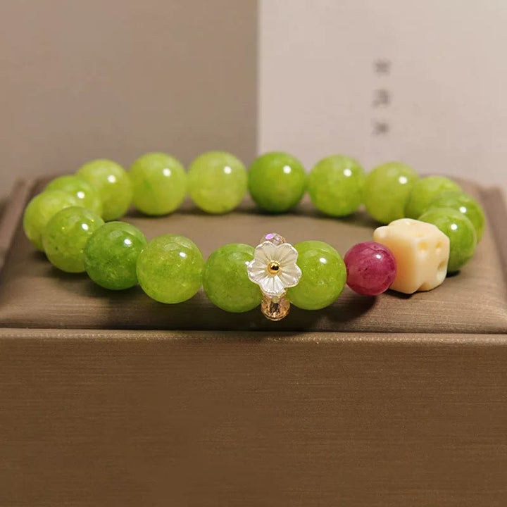 Buddha Stones Helende Armband met peridotbloembedeltje - Peridot (Polsomtrek: 16-17 cm) - image 0