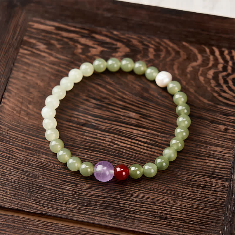Buddha Stones Armband met ronde kralen van natuurlijke Hetian-jade met een gelukseffect en kleurverloop. - image 1