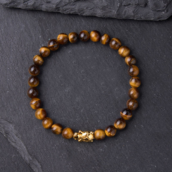 Buddha Stones Accessoires met natuurlijke tijgeroogkralen en schildpadmotief - image 1