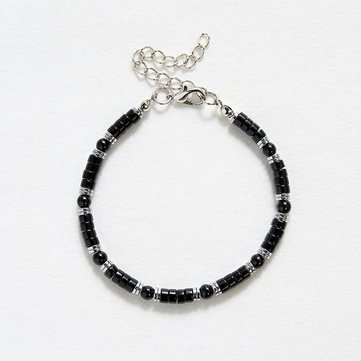 Buddha Stones Armband met cilindrische, matte zwarte onyx tussenkraaltjes - image 12