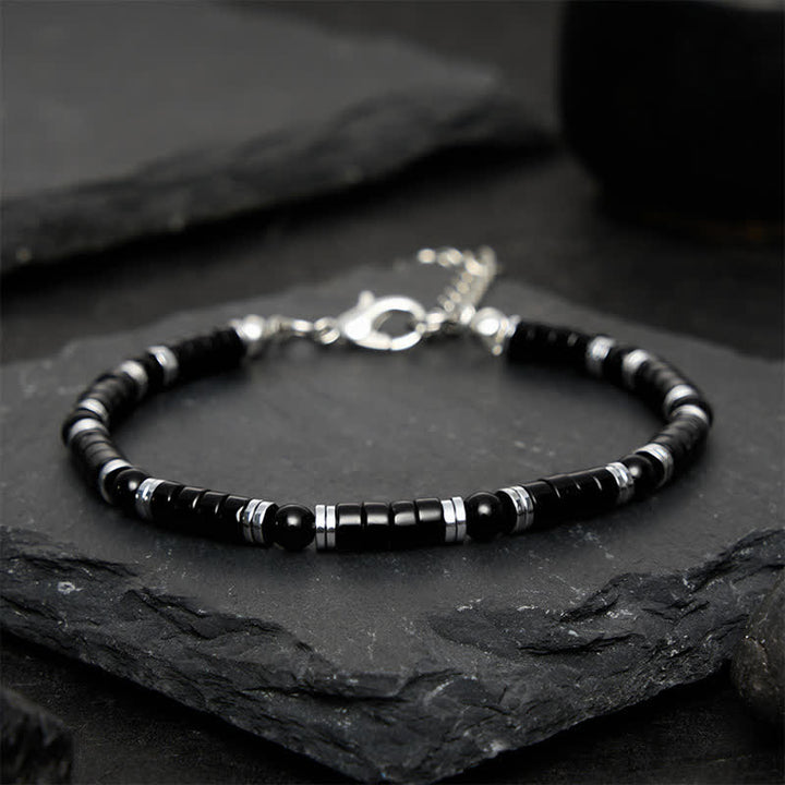 Buddha Stones Armband met cilindrische, matte zwarte onyx tussenkraaltjes - image 10