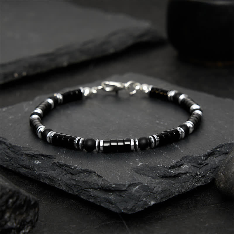 Buddha Stones Armband met cilindrische, matte zwarte onyx tussenkraaltjes - image 1